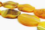 4 Polished Yellow Carnelian Wavy Oval Beads