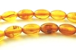 52 Golden Yellow 7mm x 5mm Amber Oval Beads