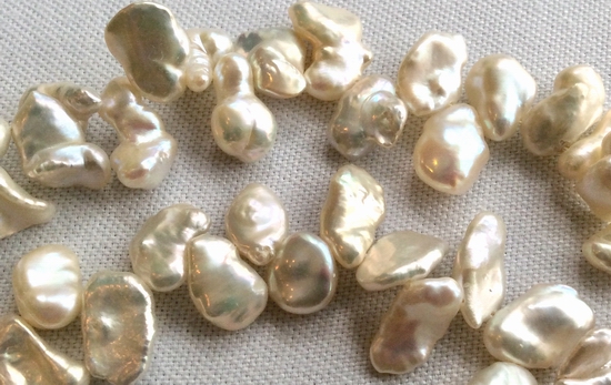 70 Large Gleaming Silvery-White Keshi Pearls