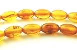 52 Golden Yellow 7mm x 5mm Amber Oval  Beads